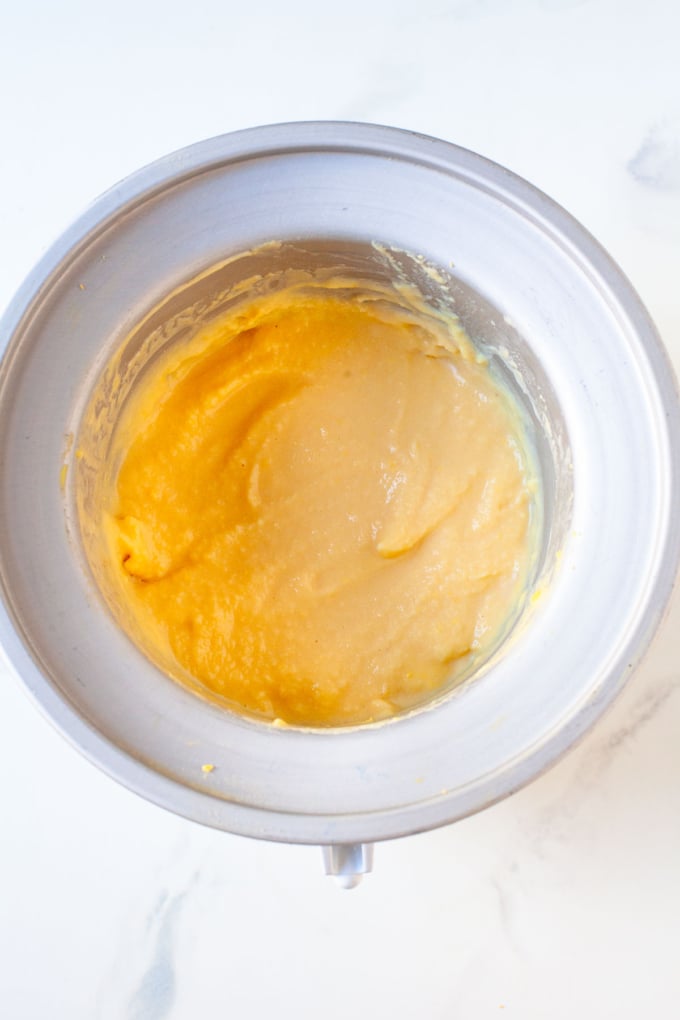 soft serve peach ice cream in ice cream freezer bowl